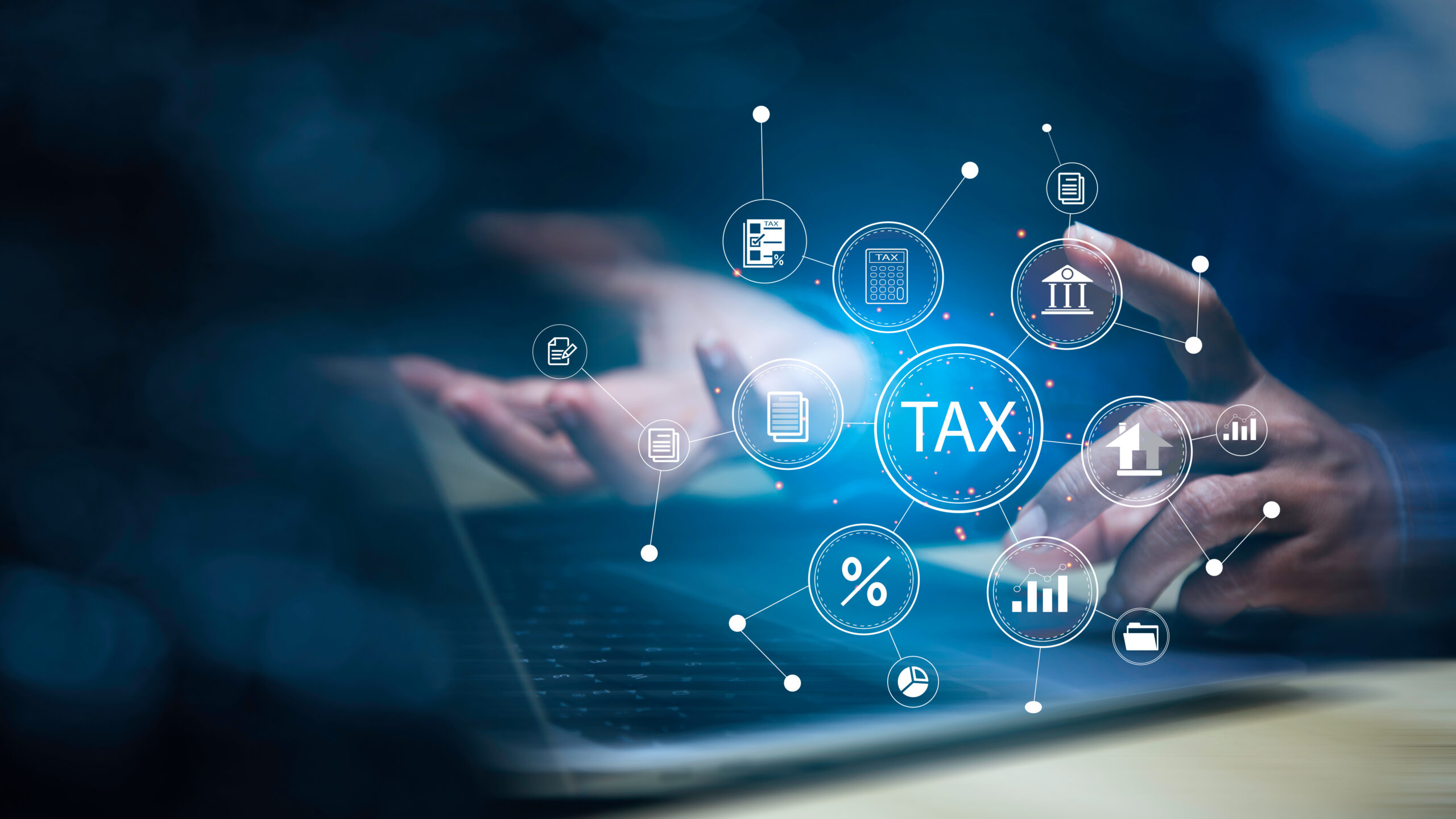 income tax concept. Businessman using laptop analyzing data to online income tax form. tax system icon around. pay online income tax. futuristic virtual screen interface technology..
